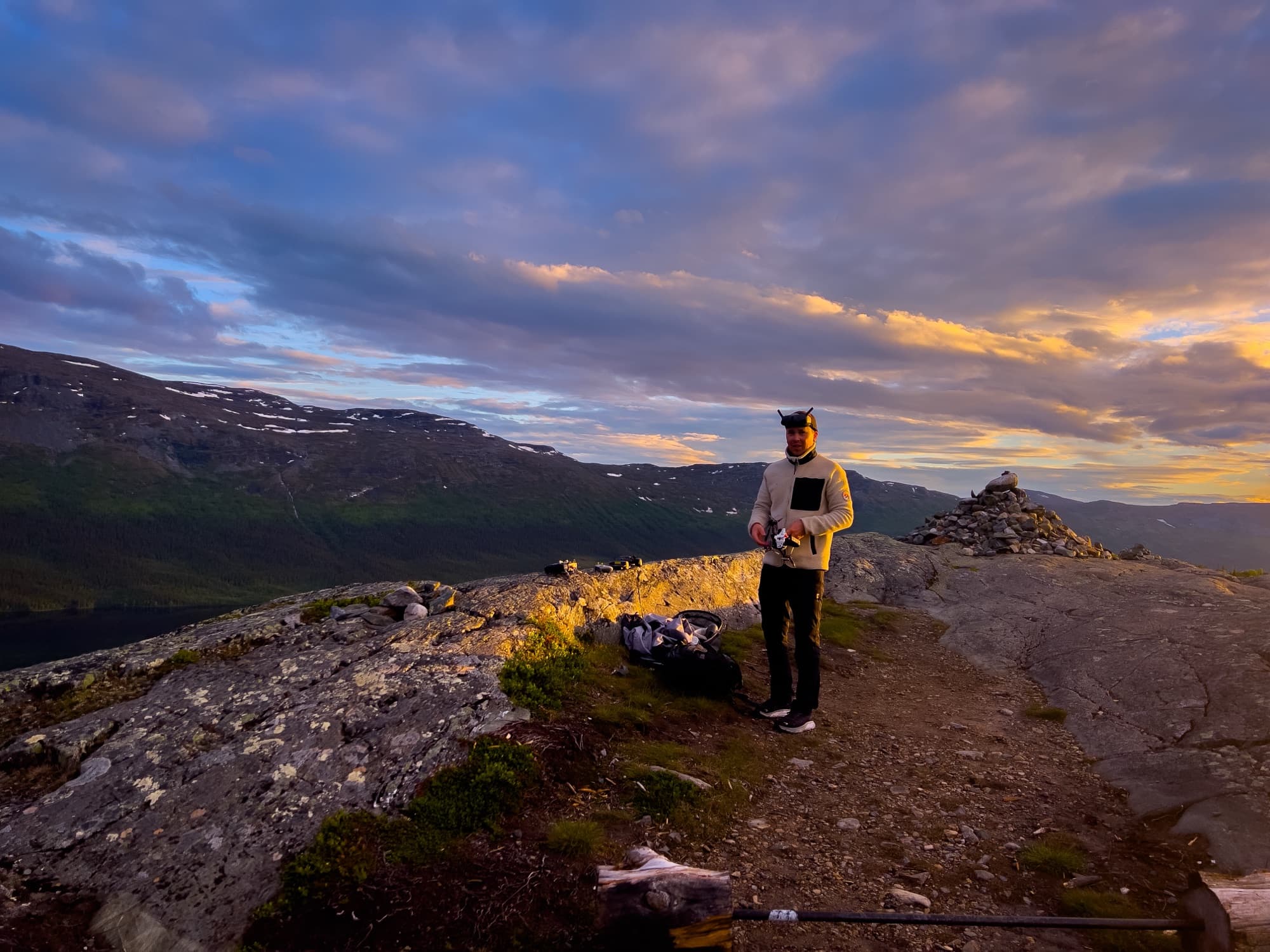 Golden hour on the summit, goggles up, between flights.